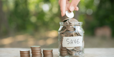 saving-money-concept-preset-by-male-hand-putting-money-coin-stack-growing-business-arrange-coins-into-heaps-with-hands-content-about-money