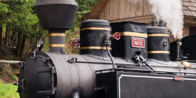 Close view of the wound-up Steam train Mocanita on a railway station in Romania